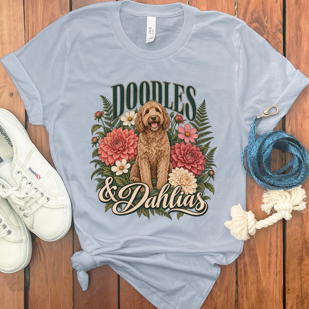 Light blue t-shirt with "Doodles & Dahlias" text and a doodle dog graphic.