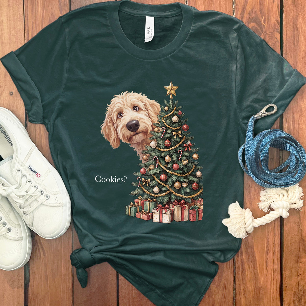 T-shirt with a doodle dog peeking behind a decorated Christmas tree that says "Cookies?".