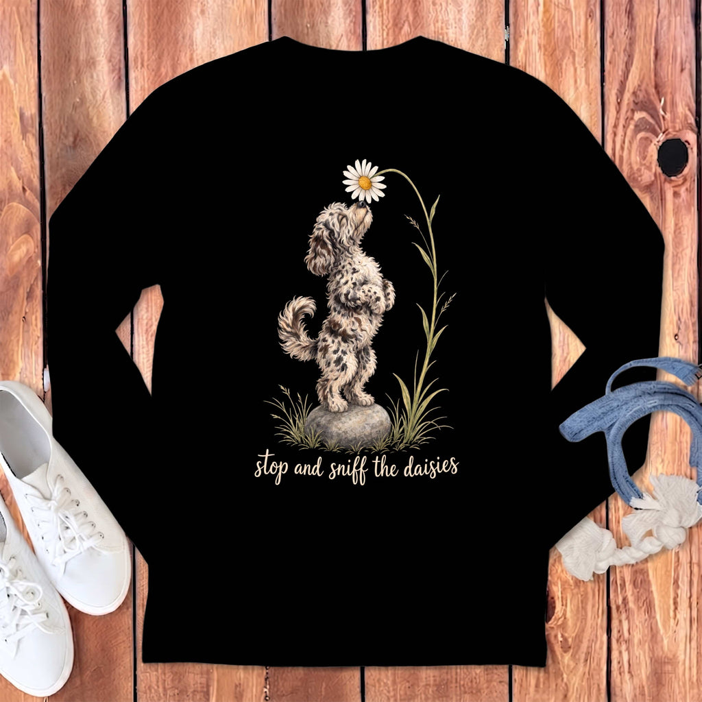 Black long sleeve shirt with a Dalmatian dog smelling a daisy and text "stop and sniff the daisies."