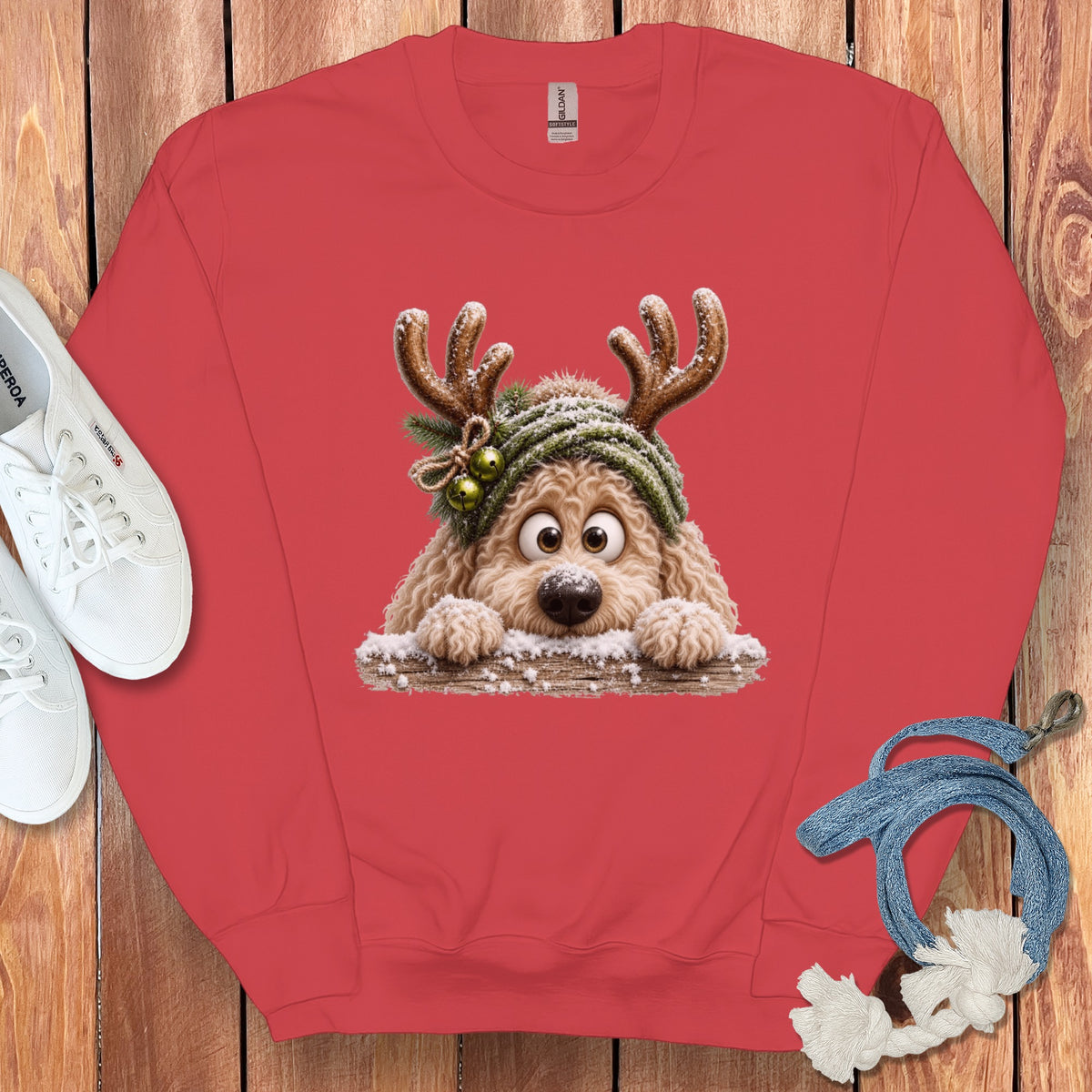Red sweatshirt with cartoon dog wearing antlers and a green beanie.