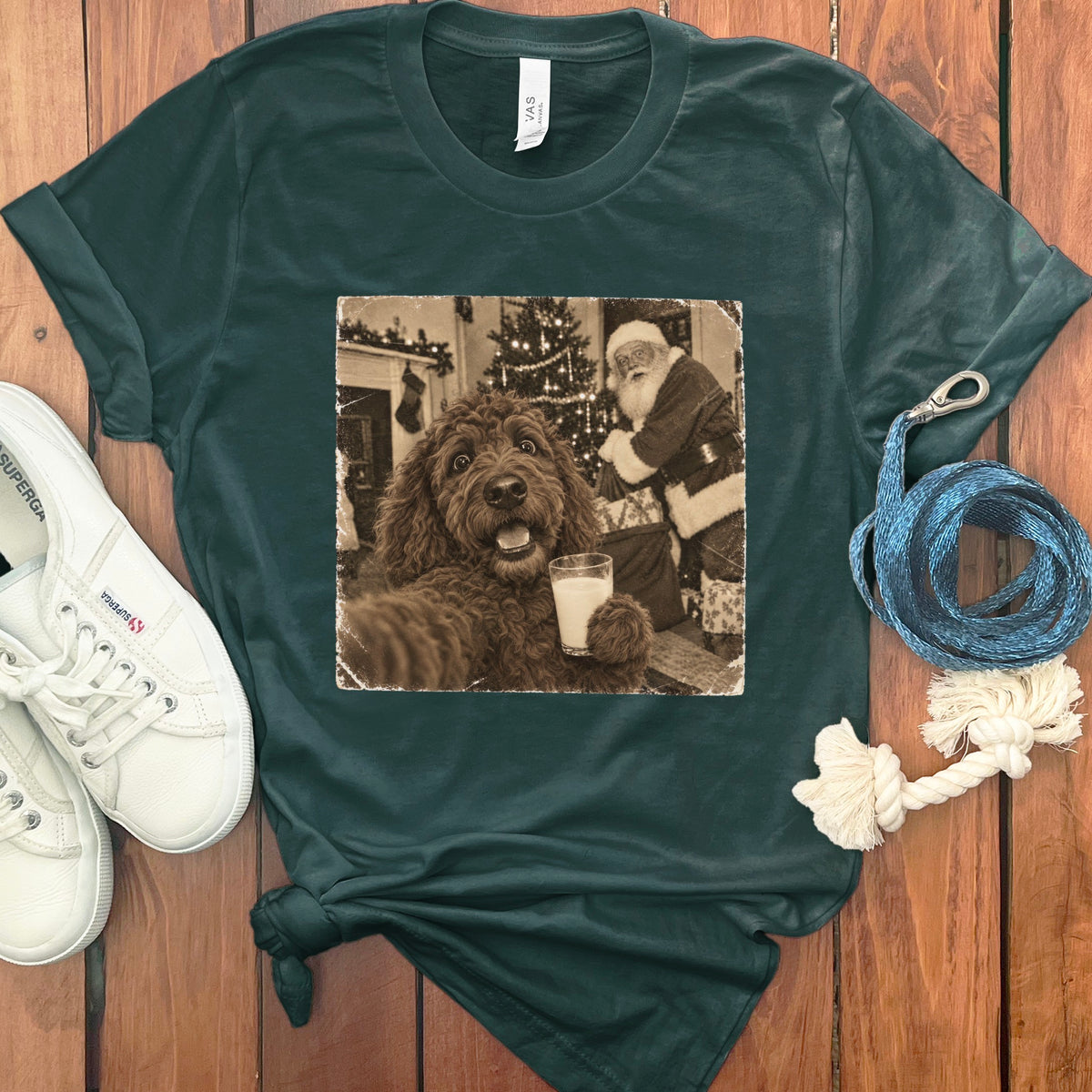 Dark green t-shirt featuring a retro graphic of a doodle dog holding a milk glass with Santa in the background.