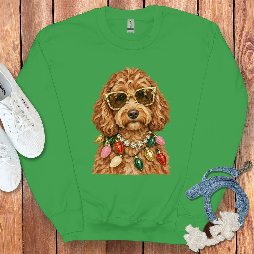 Green sweatshirt with a doodle wearing sunglasses and a Christmas light necklace.