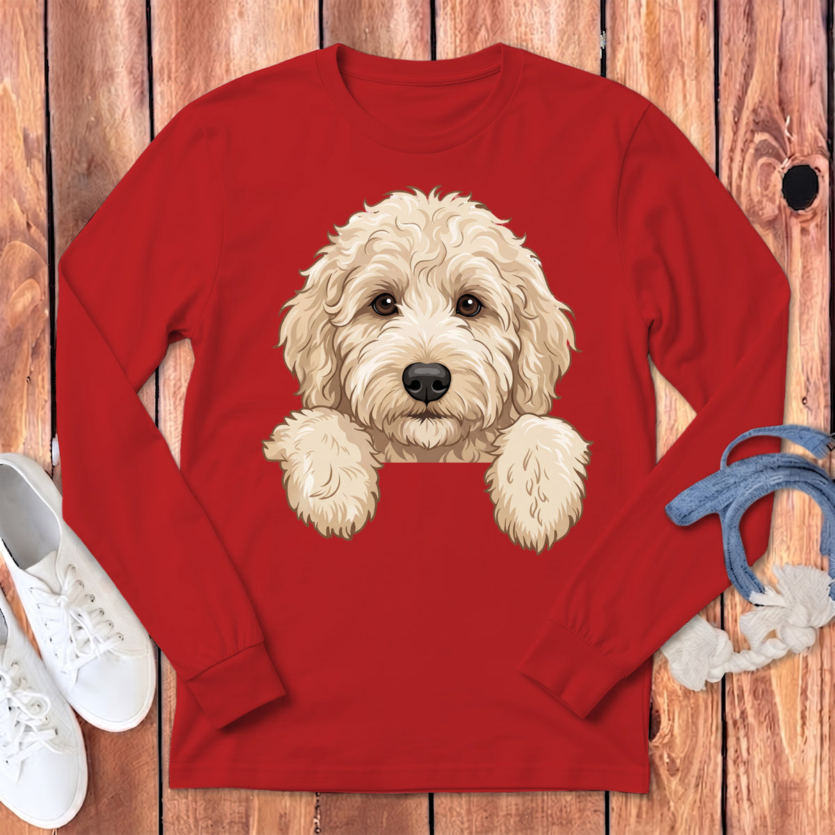 Red long-sleeve shirt with a cartoon goldendoodle dog print peeking over the top.