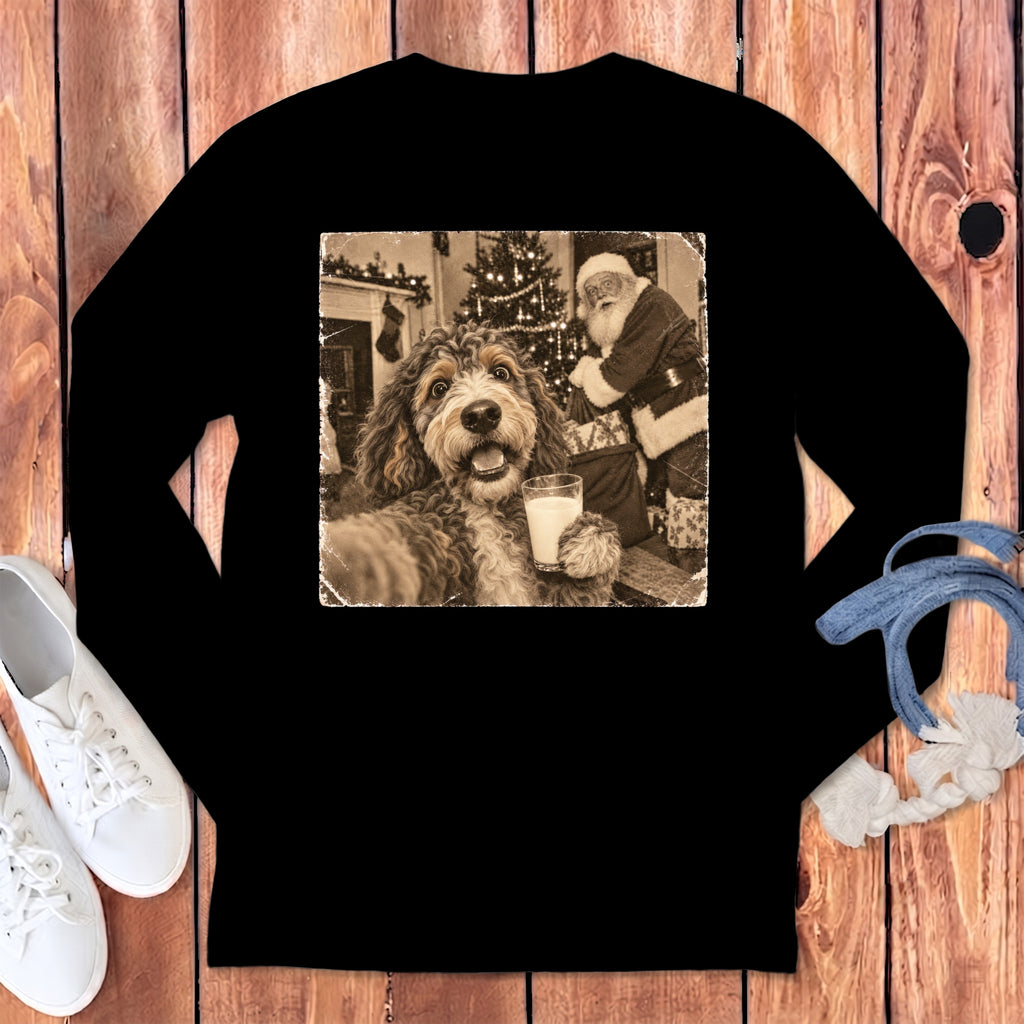 Black long-sleeve t-shirt featuring a vintage sepia graphic of a dog holding a glass of milk with Santa Claus in the background.