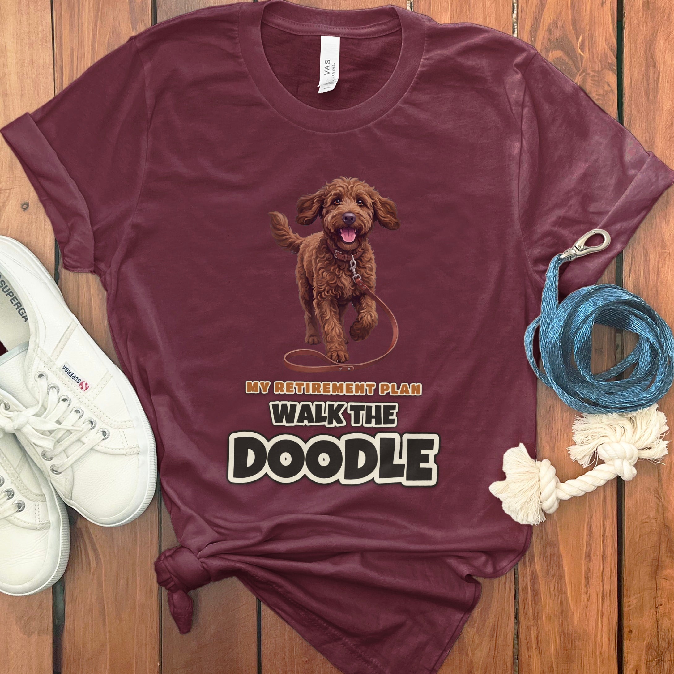 Maroon t-shirt with "My Retirement Plan Walk the Doodle" text and a doodle dog graphic.