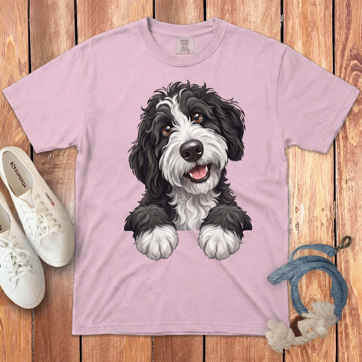 Pink t-shirt with a black and white fluffy dog illustration and "COMFORT COLORS" label.