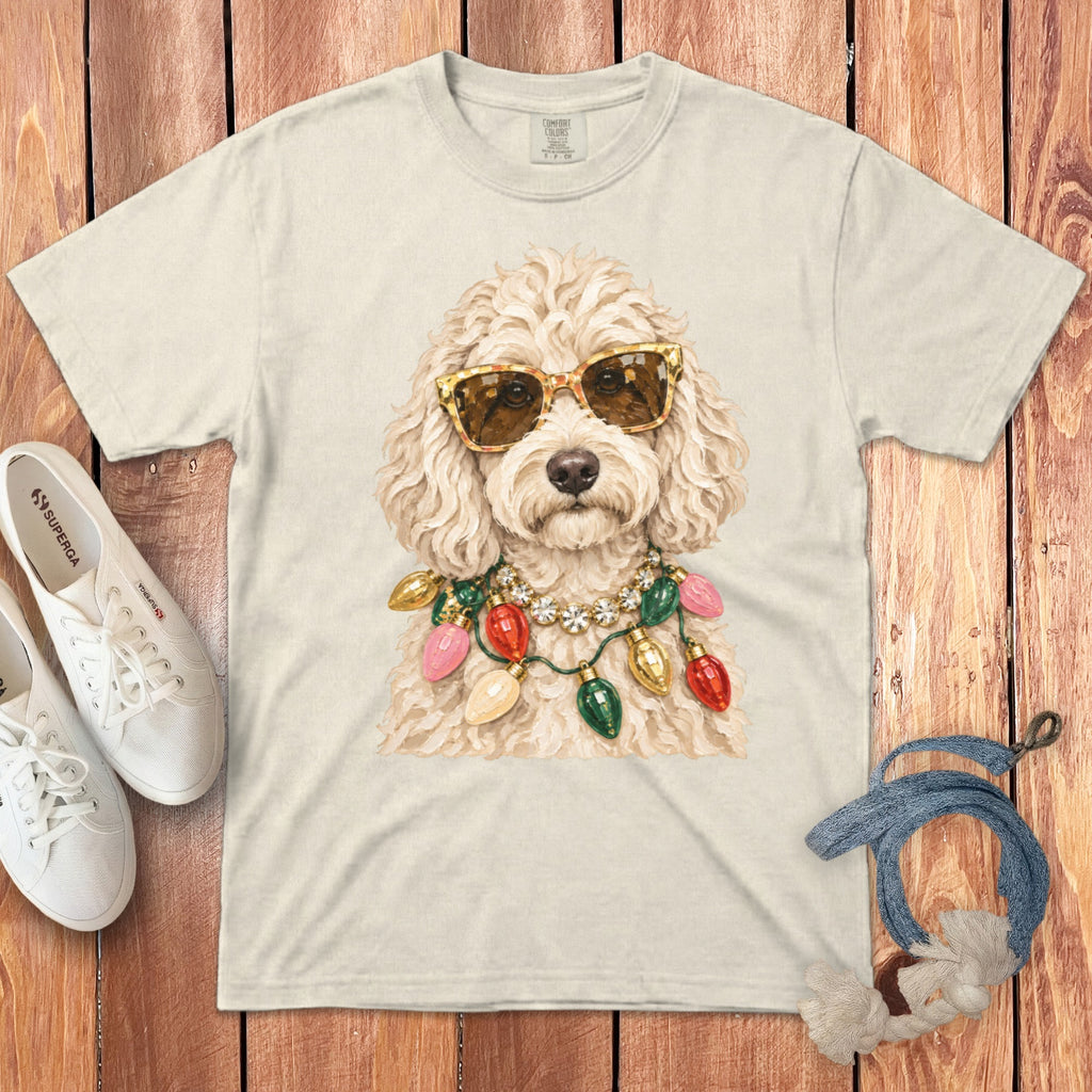 T-shirt with a fluffy dog wearing sunglasses and a string of Christmas lights.
