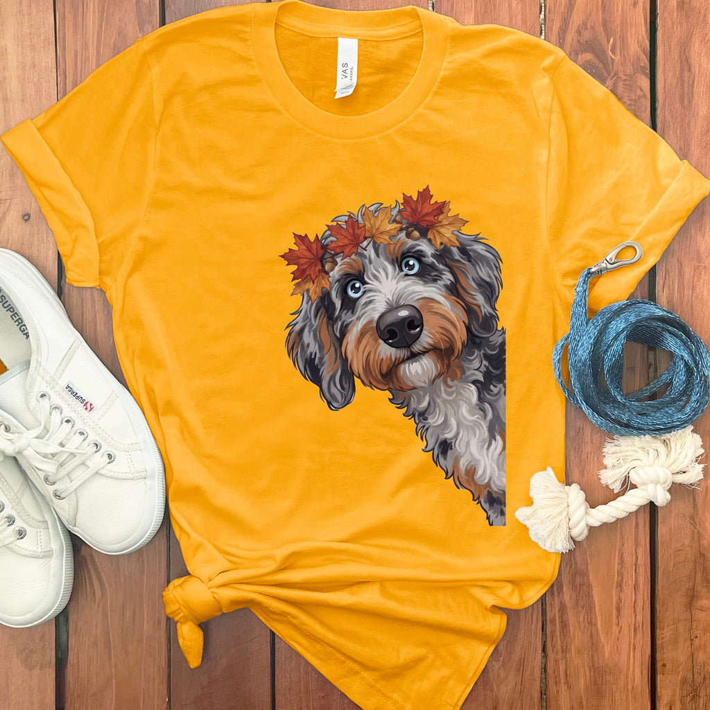 Yellow t-shirt with illustrated dog wearing a fall leaves crown.