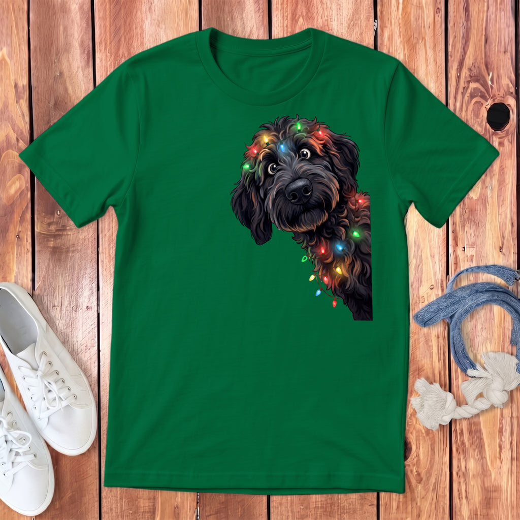 Green t-shirt with a black doodle dog wearing colorful Christmas lights.