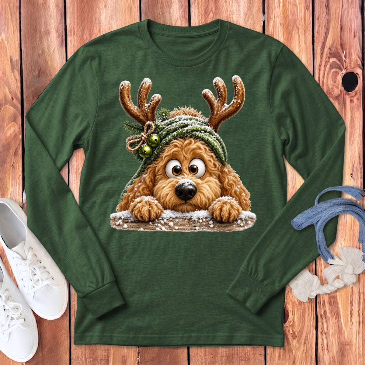 Green long-sleeve t-shirt with a cartoon dog wearing reindeer antlers and a snowy hat.