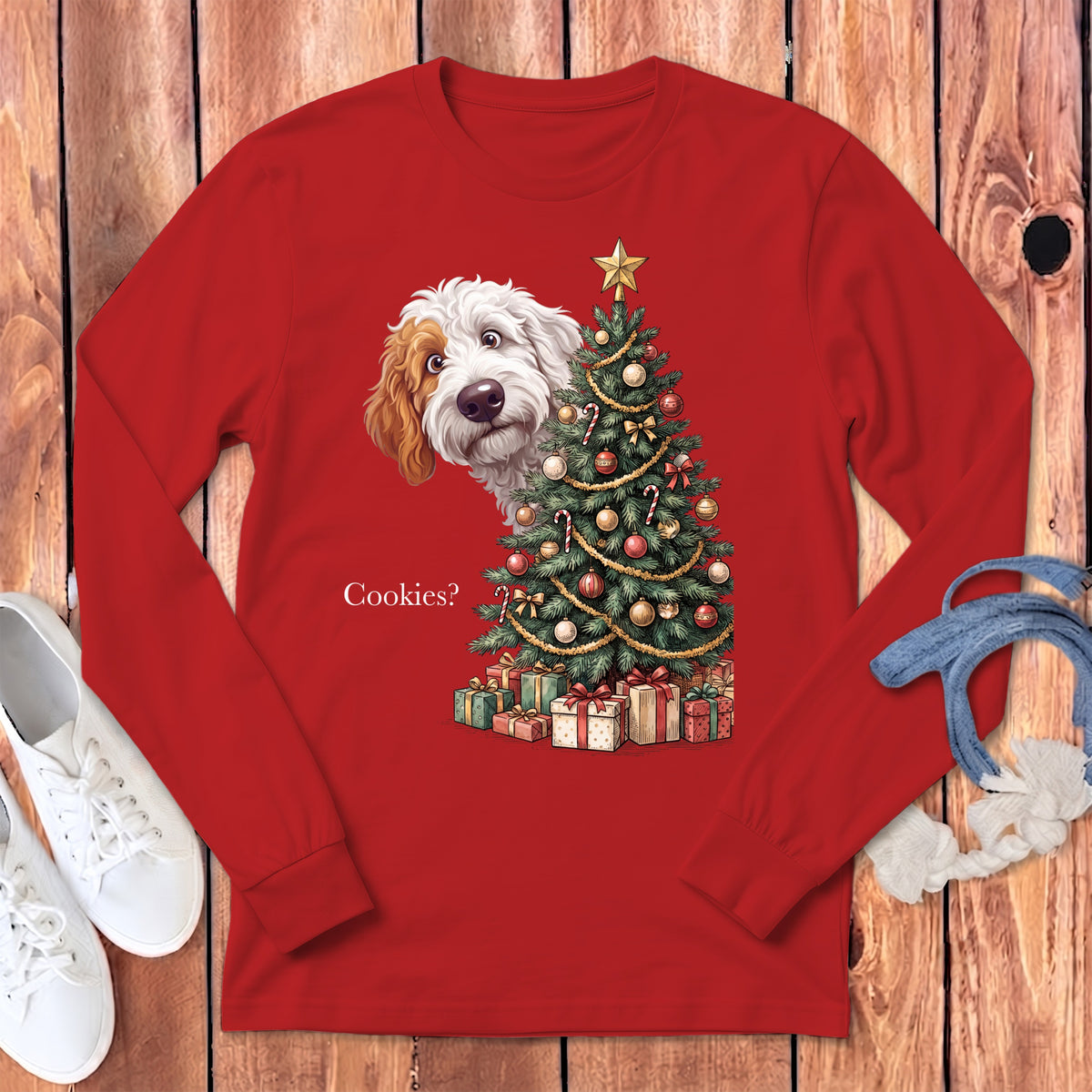 Red long-sleeve shirt with a doodle dog peeking from behind a Christmas tree and gifts.