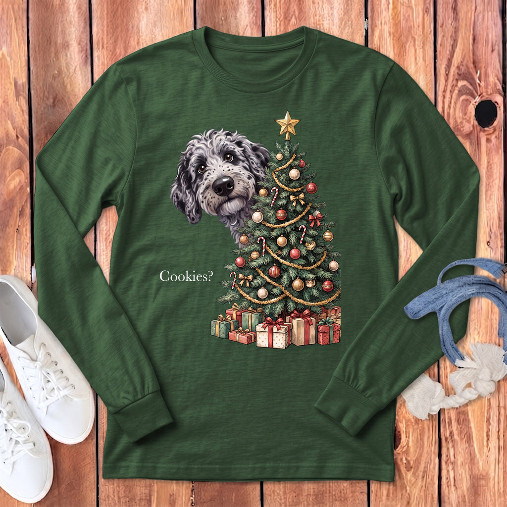 Green long sleeve shirt with a dog peeking from behind a decorated Christmas tree.