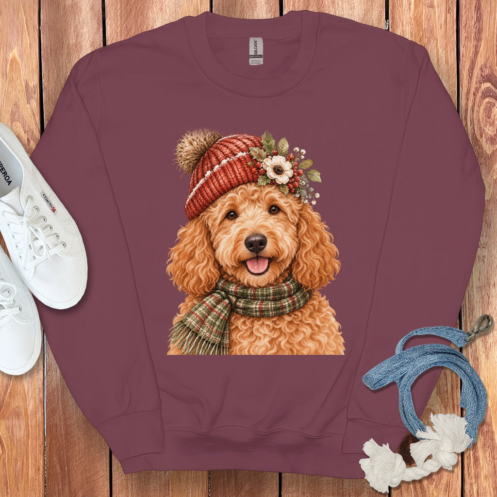 Maroon sweatshirt with a whimsical doodle dog wearing a red knit hat and scarf.