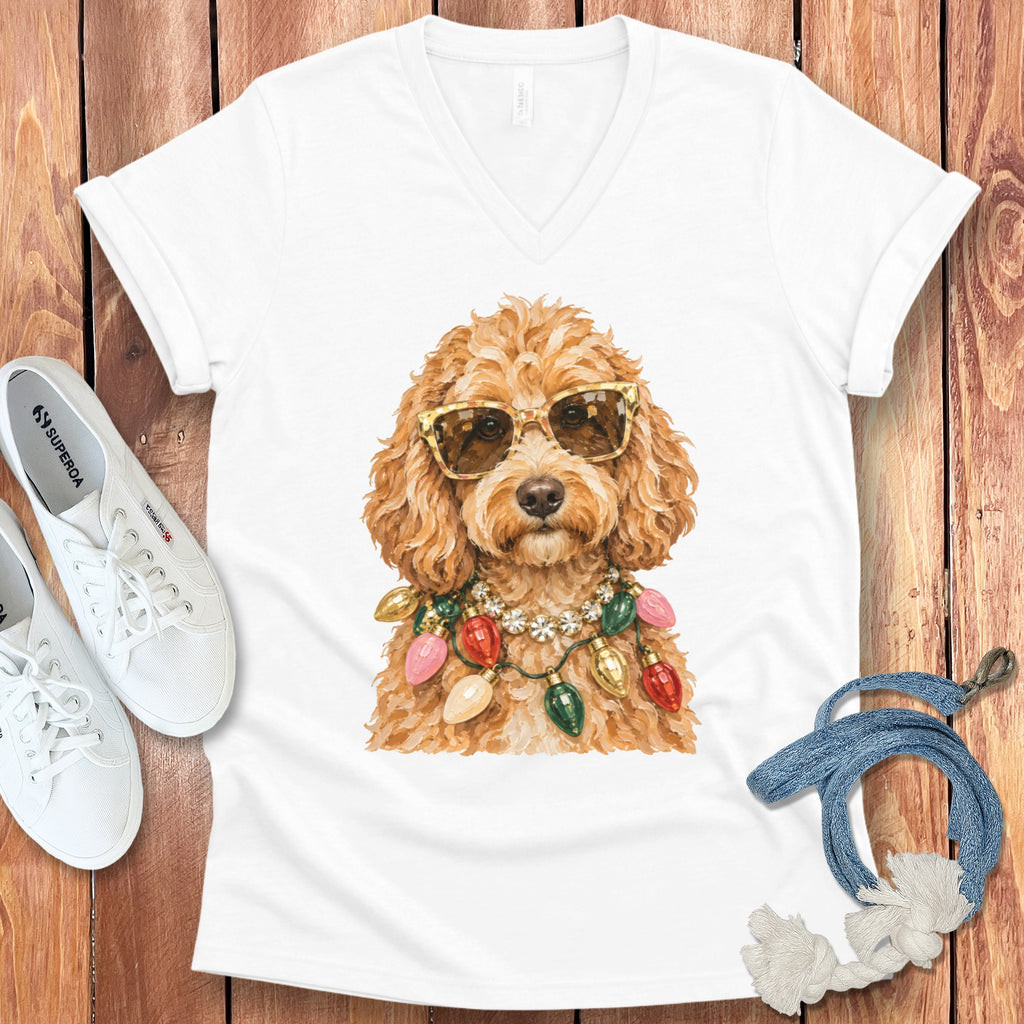 White t-shirt with a doodle wearing sunglasses and Christmas lights necklace.