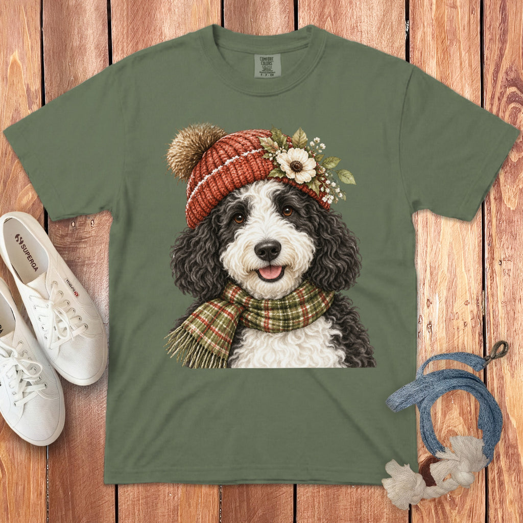 Green t-shirt with a cartoon dog wearing a beanie and scarf.