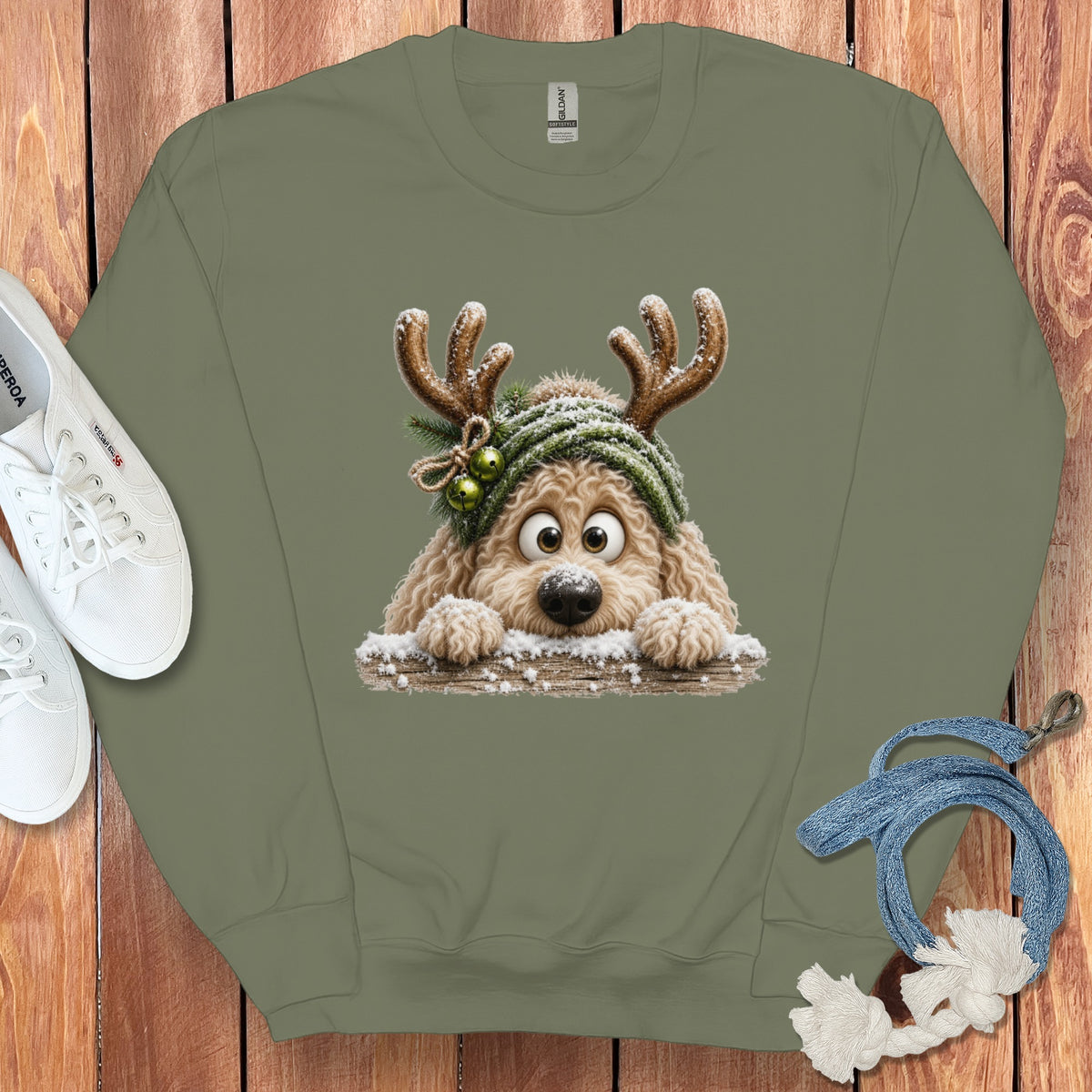Olive green sweatshirt with a cartoon dog wearing antlers and a green beanie.