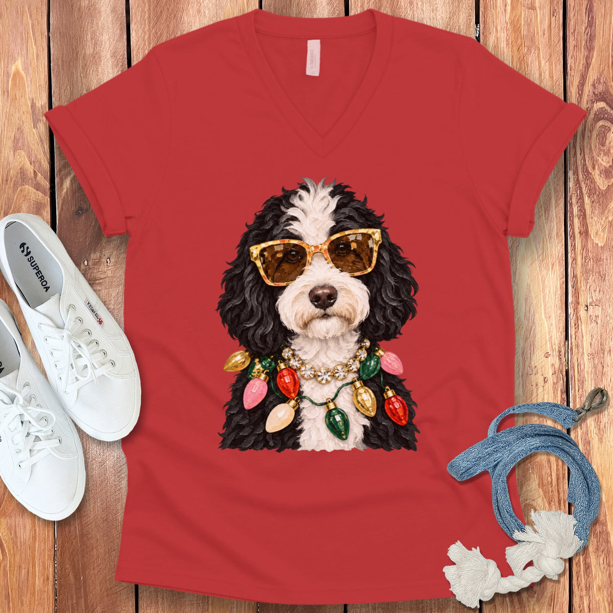 Red t-shirt with a Bernedoodle wearing sunglasses and a Christmas light necklace.