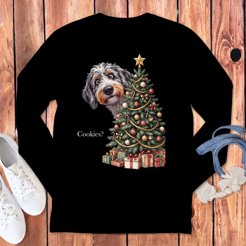 Dog peeking by a Christmas tree with presents and text "Cookies?".