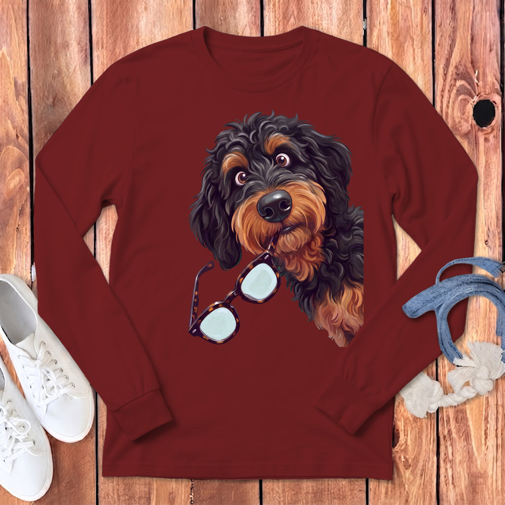 Maroon long-sleeved crewneck sweatshirt featuring an illustrated black and brown dog holding glasses in its mouth.