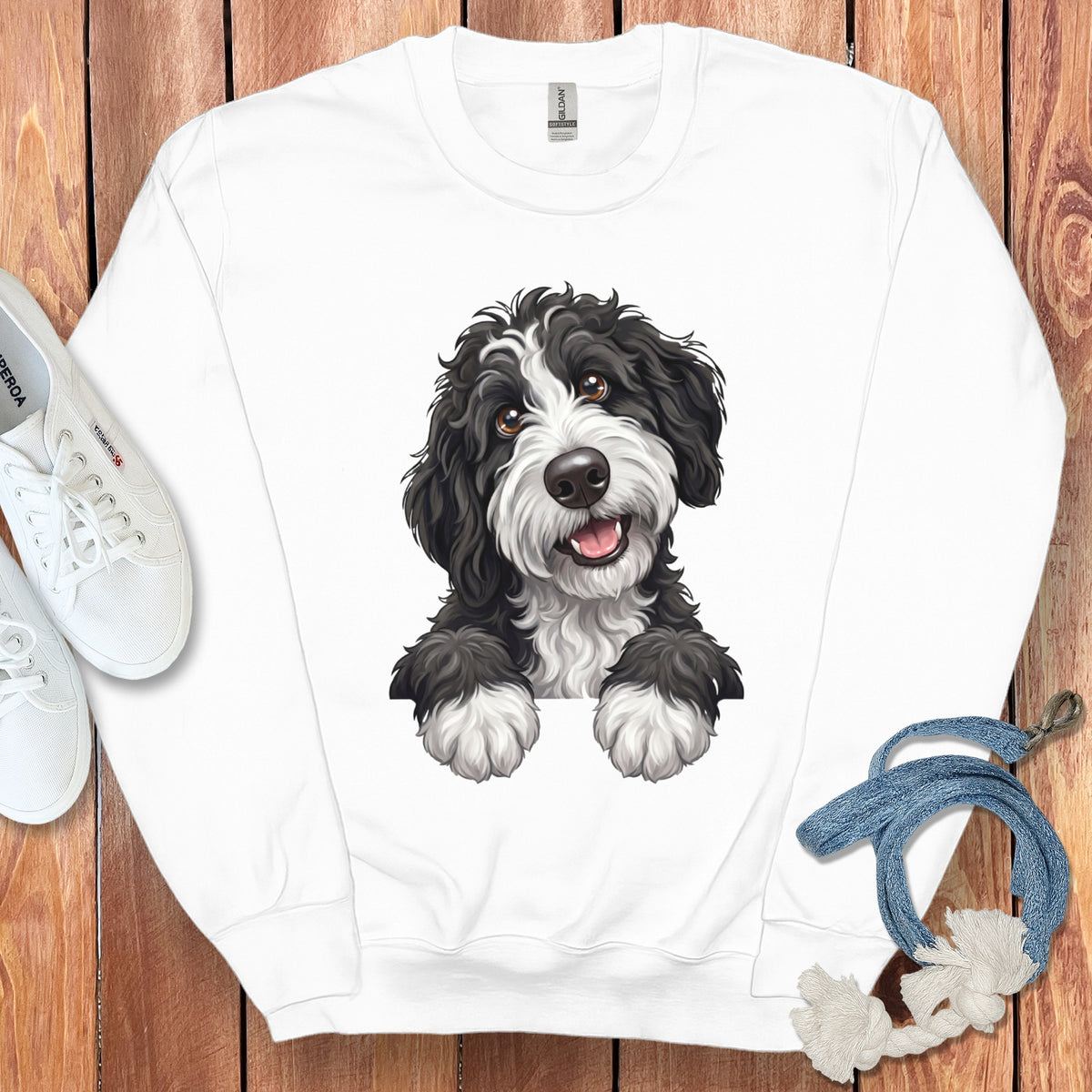 White sweatshirt with a black and white dog illustration on the front.