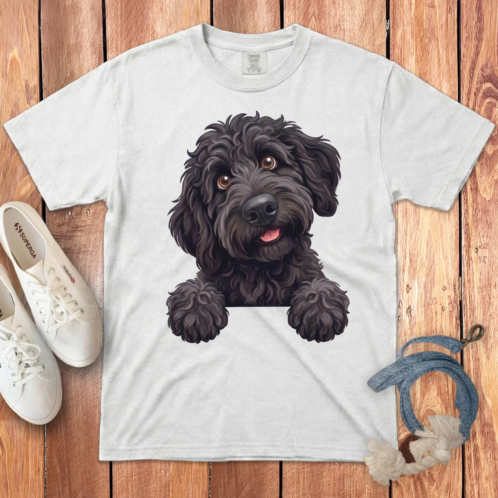White t-shirt with a black poodle illustration peeking over a white line.