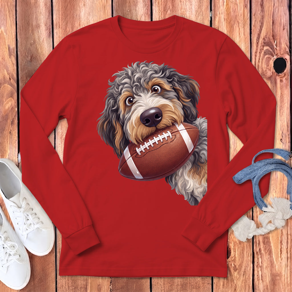 Red long-sleeve shirt with a dog holding a football graphic.
