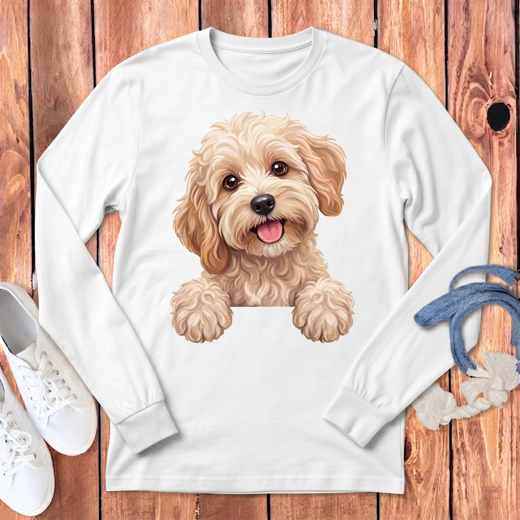 White long-sleeve shirt featuring a smiling, fluffy light brown dog peeking over a white surface.