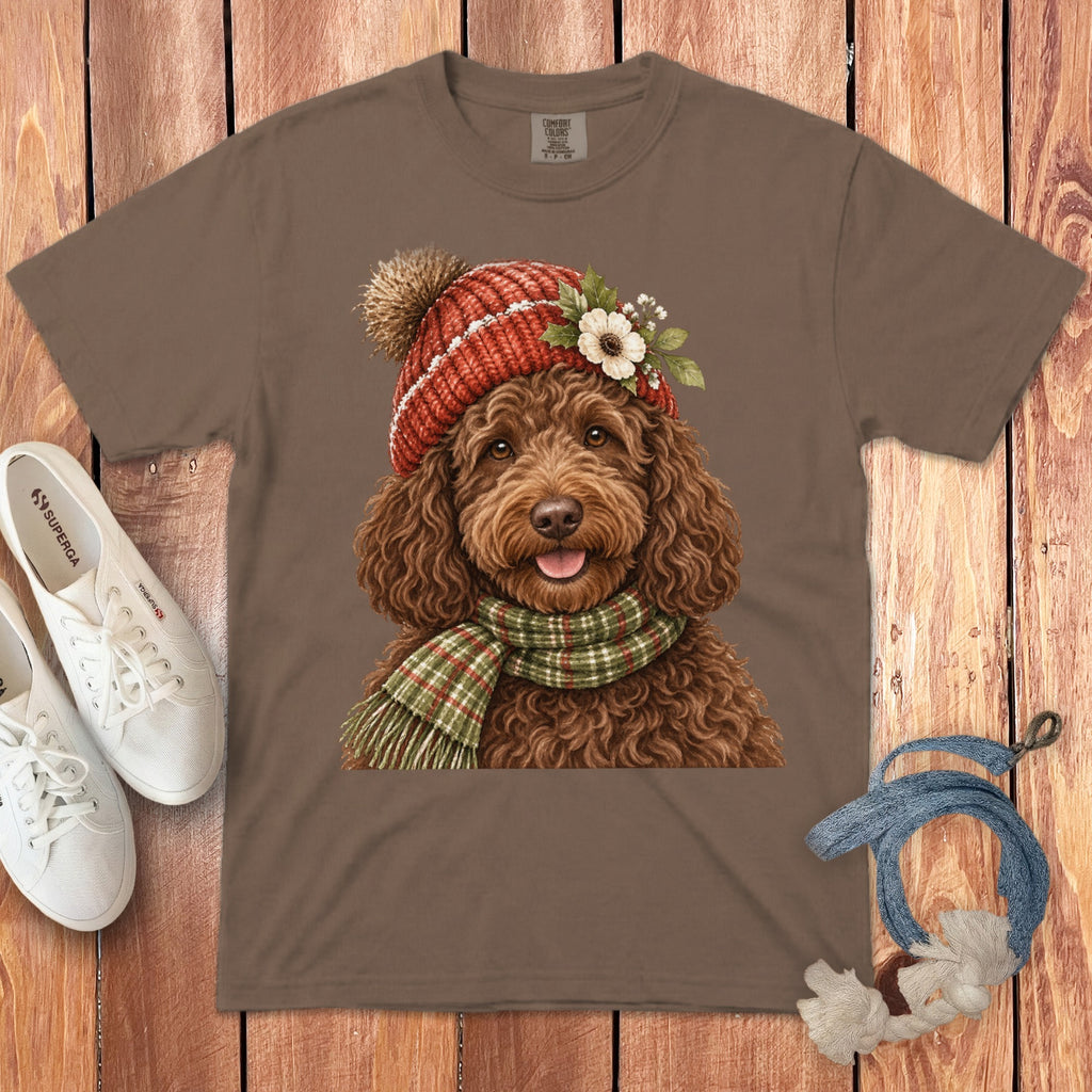 Brown t-shirt featuring a watercolor doodle dog wearing a knitted hat and scarf.