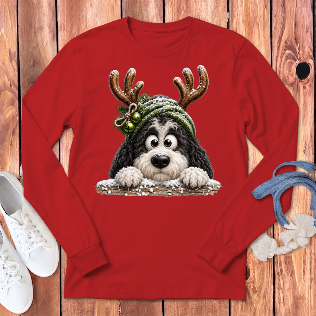Red long-sleeve shirt with a black and white dog wearing antlers and a green hat.