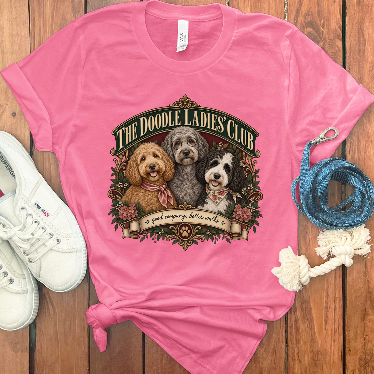 Pink t-shirt with "The Doodle Ladies' Club" graphic featuring three doodles and text.