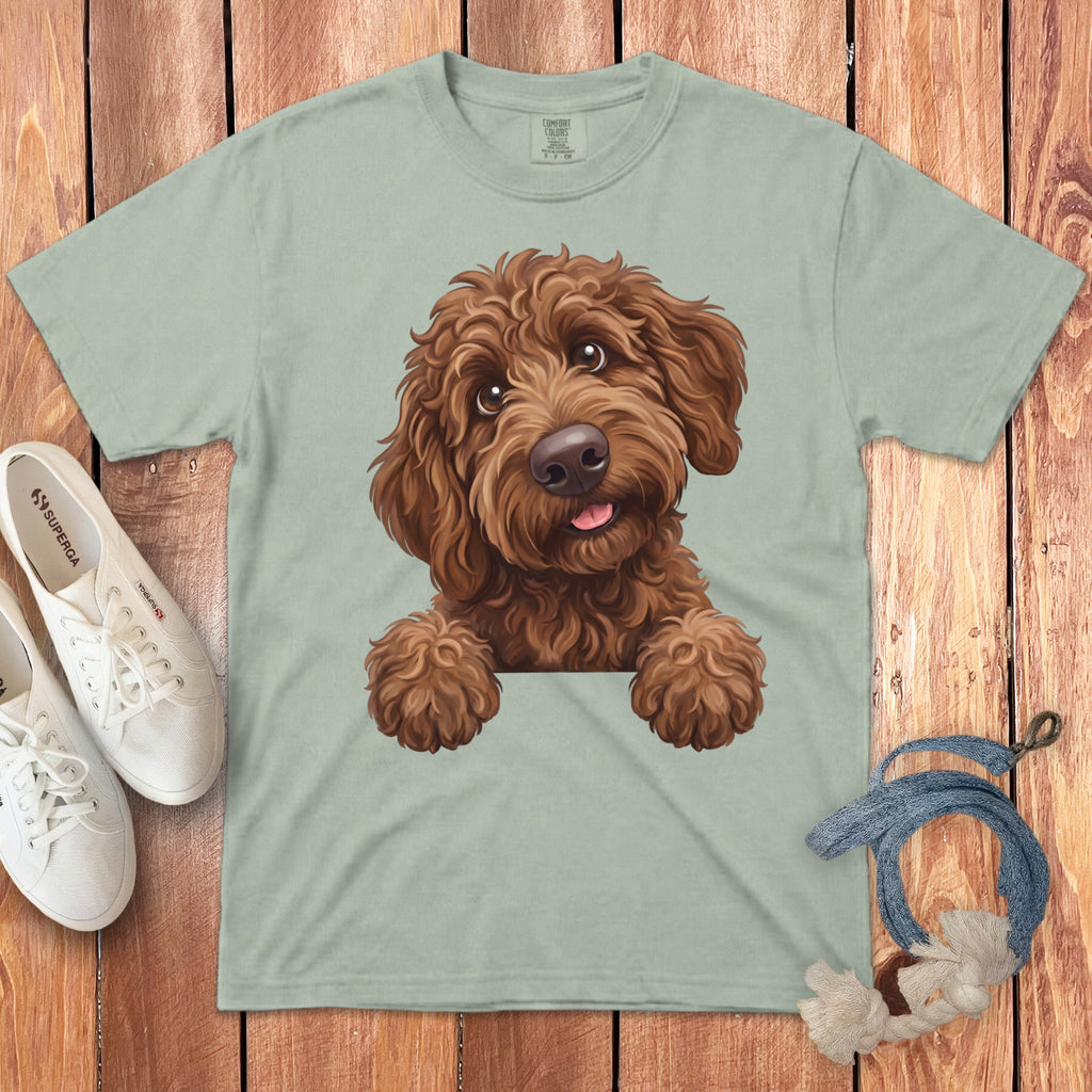 Light sage t-shirt with a brown doodle dog graphic peeking over the front.