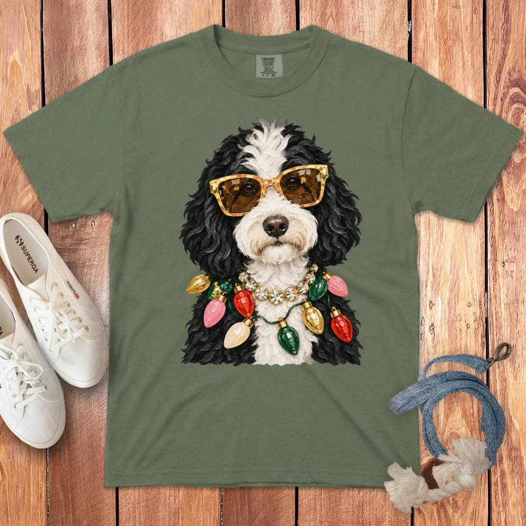 Green t-shirt with a dog wearing sunglasses and Christmas lights necklace.