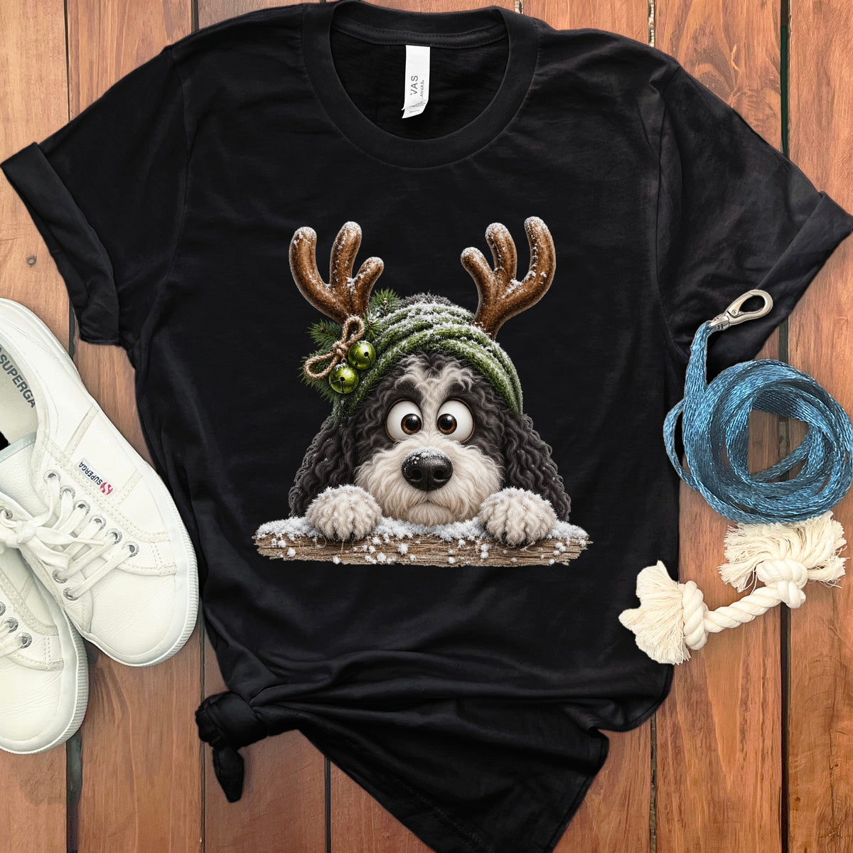 Black t-shirt with a Bernedoodle wearing reindeer antlers and a winter hat.