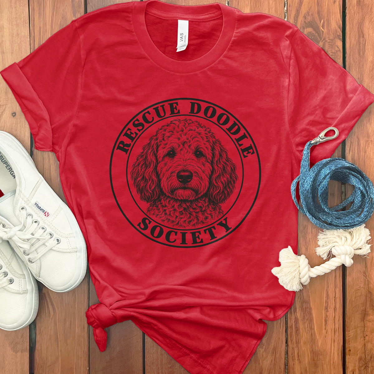Red t-shirt with a black circle graphic of a doodle dog and "Rescue Doodle Society" text.