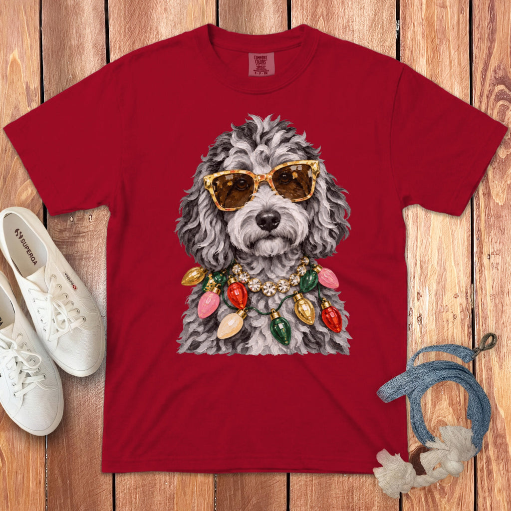 Red t-shirt with poodle wearing sunglasses and Christmas lights necklace.