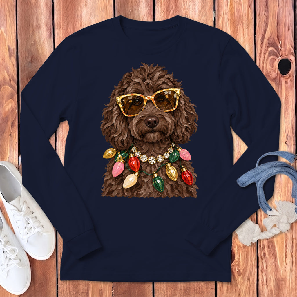 Brown poodle wearing gold sunglasses and a string of colorful Christmas lights.