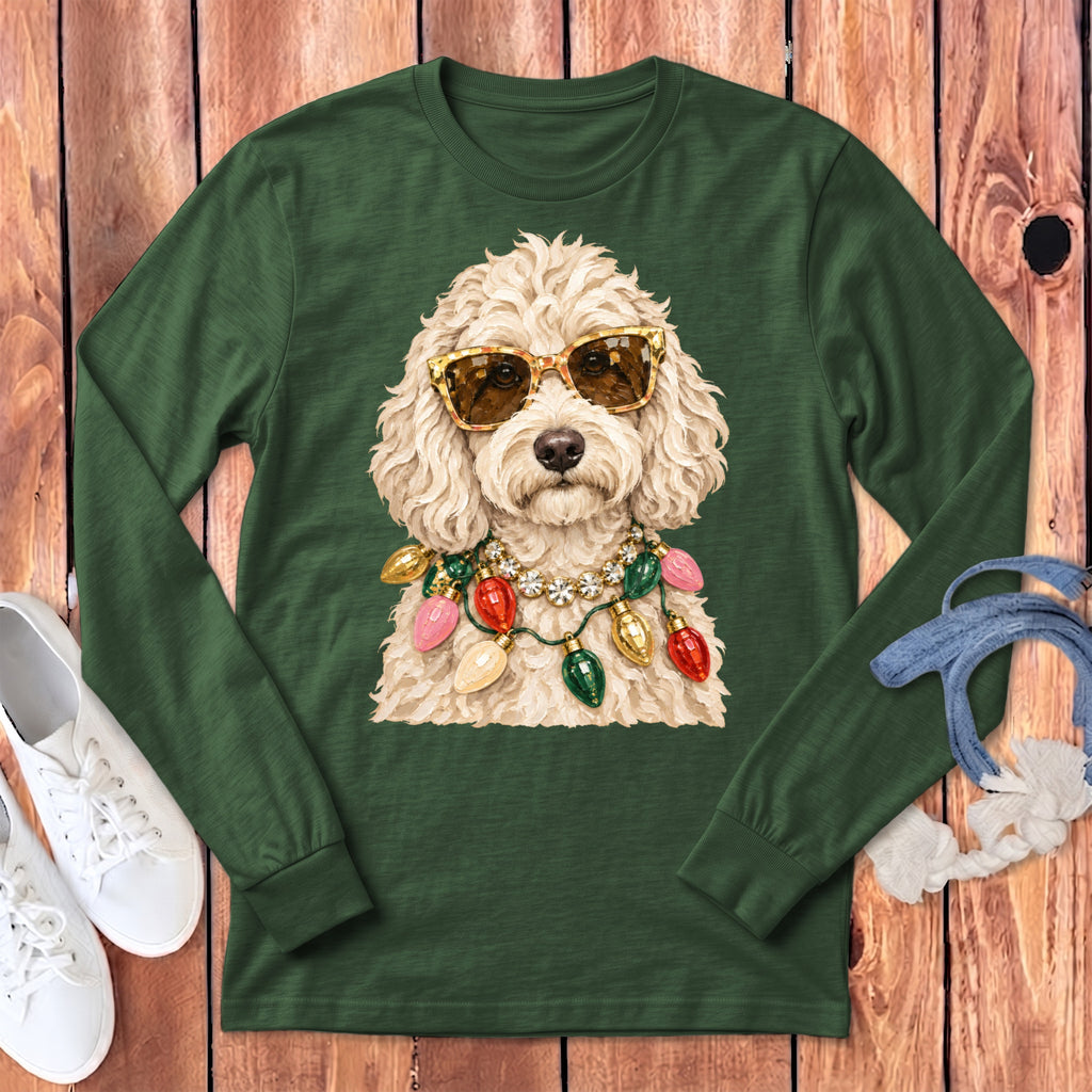 Green long-sleeved shirt with a cream-colored dog wearing sunglasses and Christmas lights.
