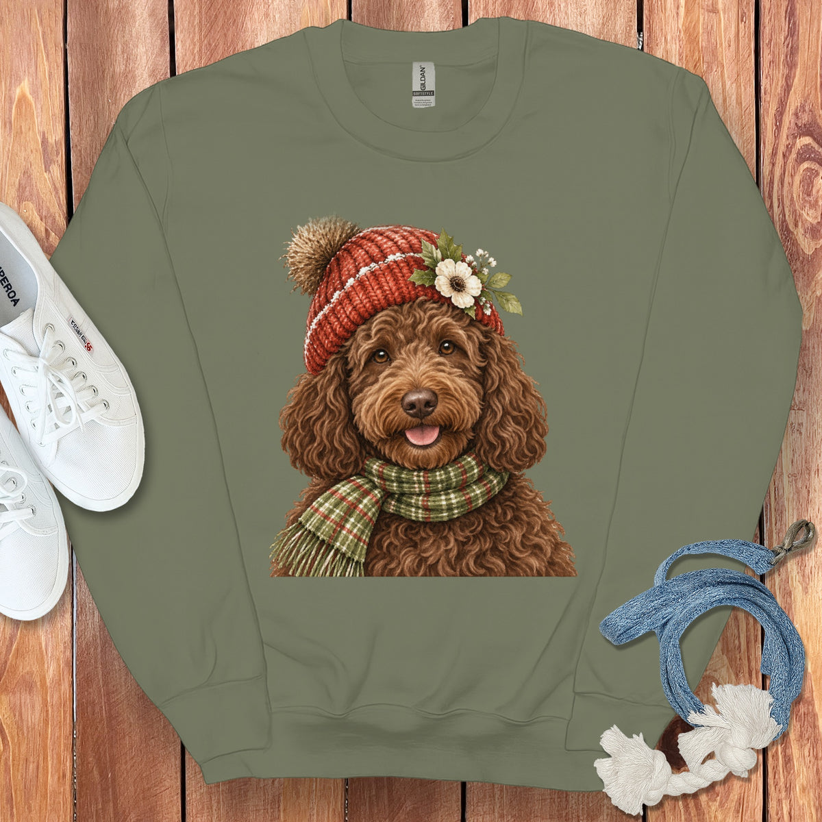 Crewneck sweatshirt with a watercolor illustration of a brown doodle dog wearing a hat and scarf.