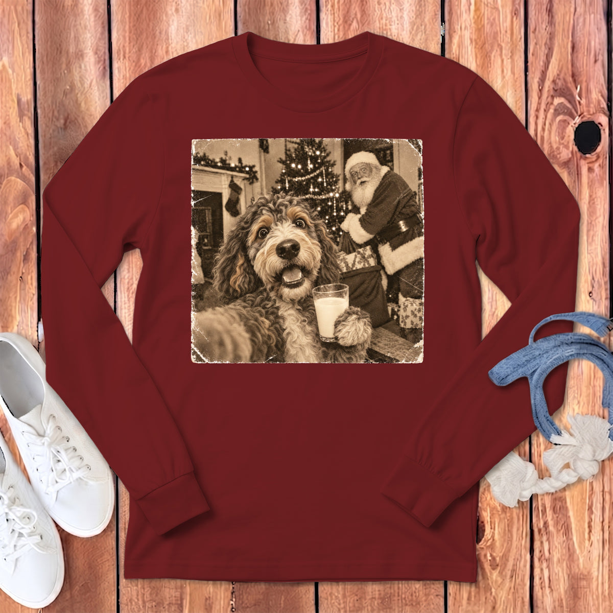Maroon long-sleeve t-shirt with a vintage graphic of a dog holding a glass of milk with Santa Claus in the background.