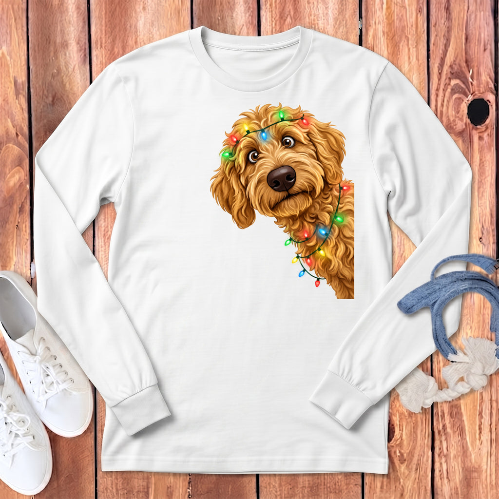 Goldendoodle wearing colorful Christmas lights on a white long-sleeved shirt.