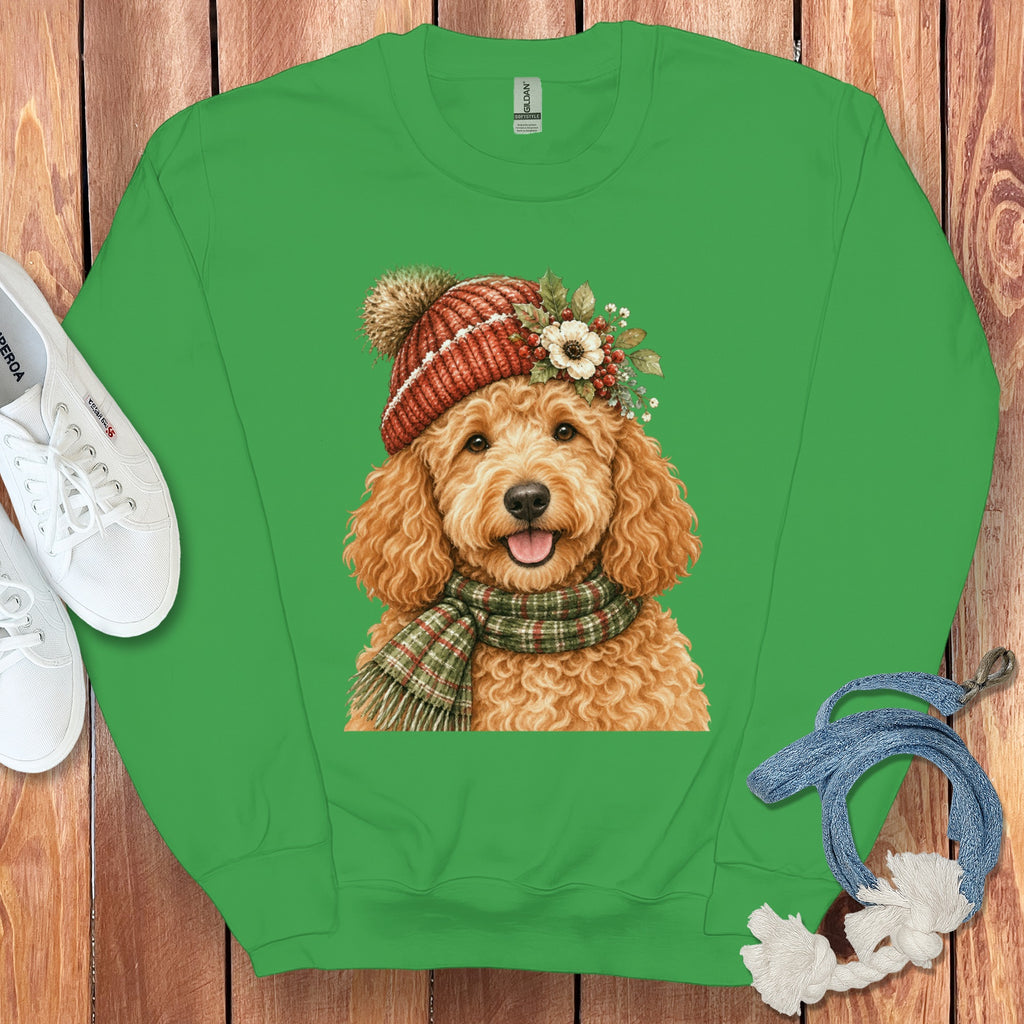 Green sweatshirt with doodle dog wearing a knitted hat and scarf graphic.