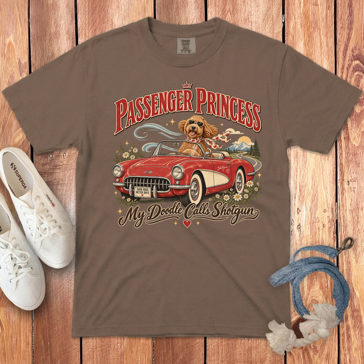 Brown t-shirt with a doodle in a red convertible, "Passenger Princess" text.