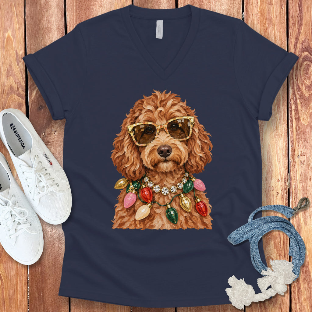 Labradoodle wearing sunglasses and a Christmas lights necklace.