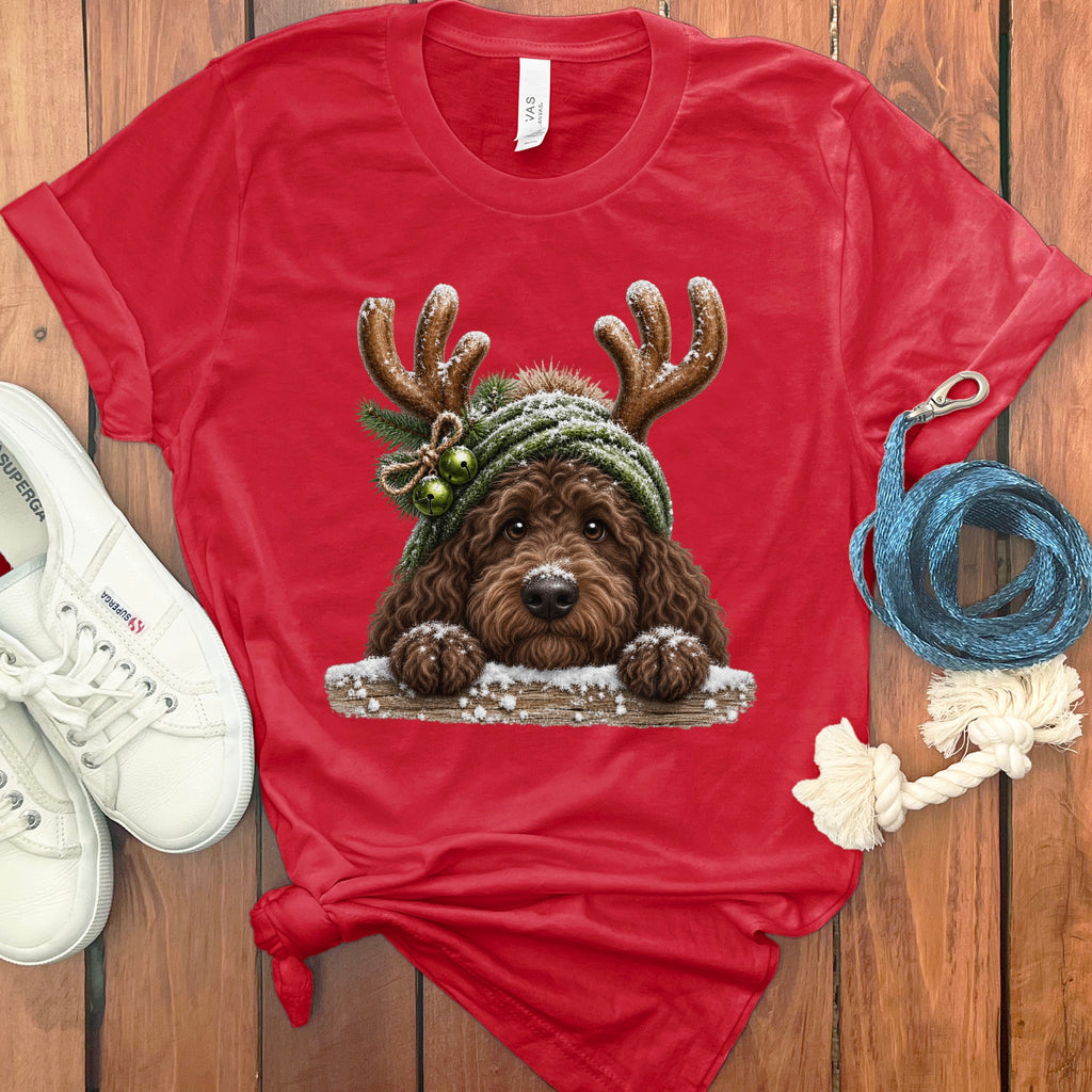 Red t-shirt with a doodle dog wearing antlers and a beanie with jingle bells.