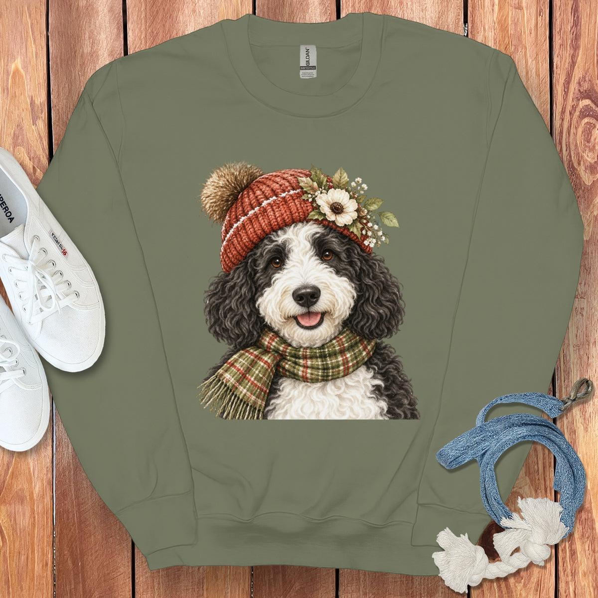 Crewneck sweatshirt with illustration of a fluffy dog wearing a beanie and scarf.