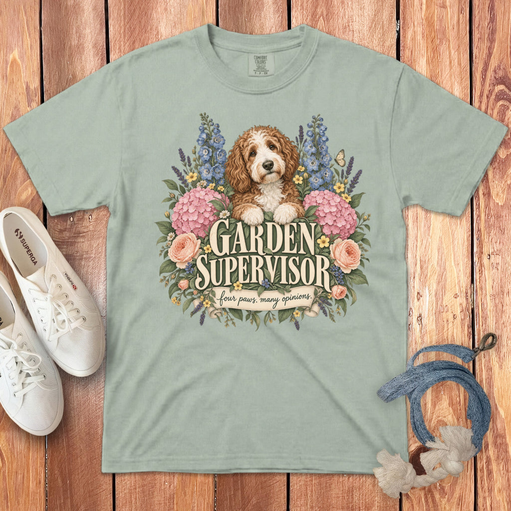 Sage green t-shirt featuring a goldendoodle puppy surrounded by flowers and the text Garden Supervisor.