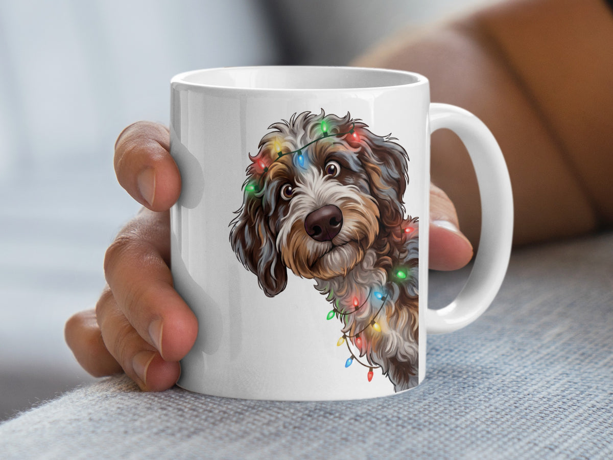 White mug with doodle dog wearing colorful Christmas lights on its head.