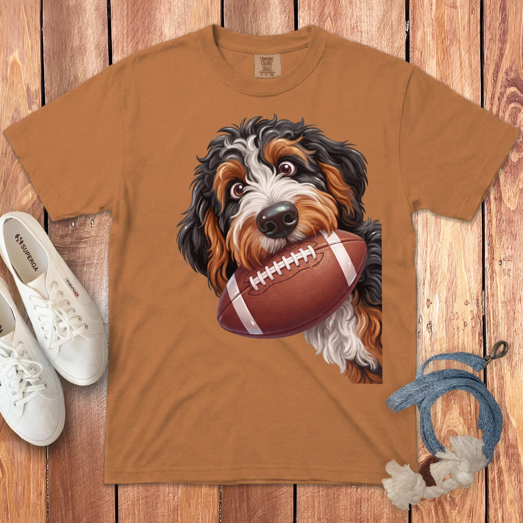 Brown t-shirt with a Bernese Mountain Dog puppy holding a football.