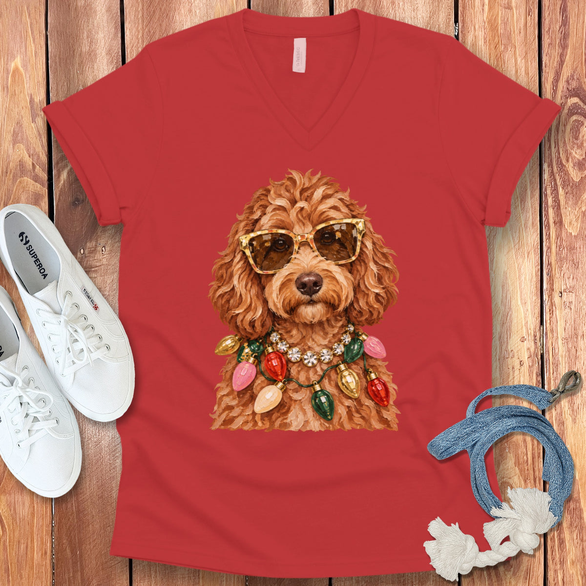 Red v-neck t-shirt featuring a dog wearing sunglasses and a string of Christmas lights.