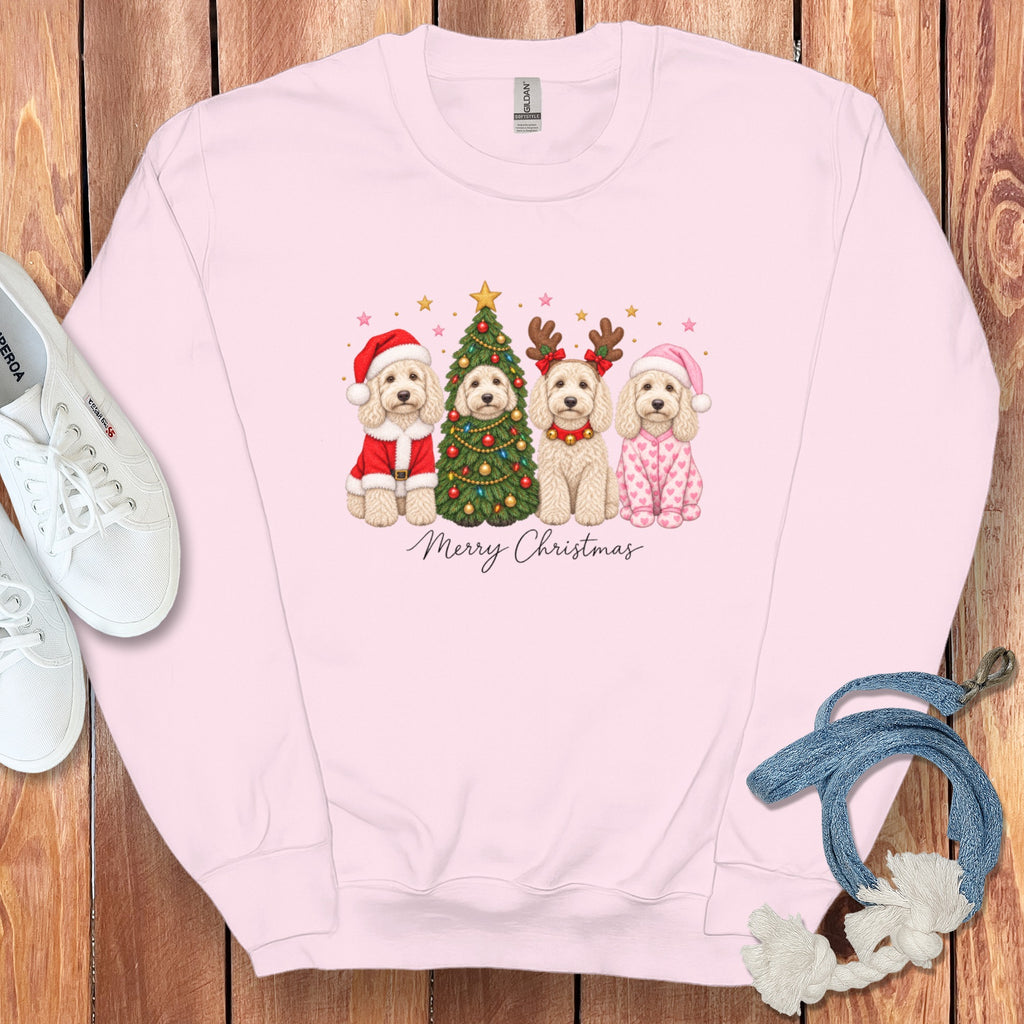Light pink crewneck sweatshirt with a graphic of four doodle dogs, a Christmas tree, and Merry Christmas text.